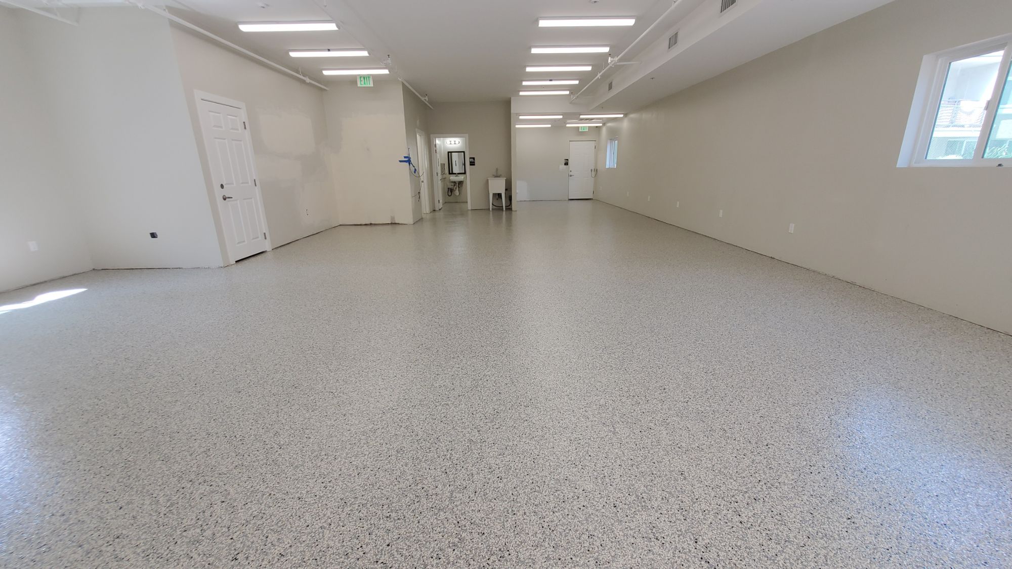 Finished flake epoxy floor in an open interior