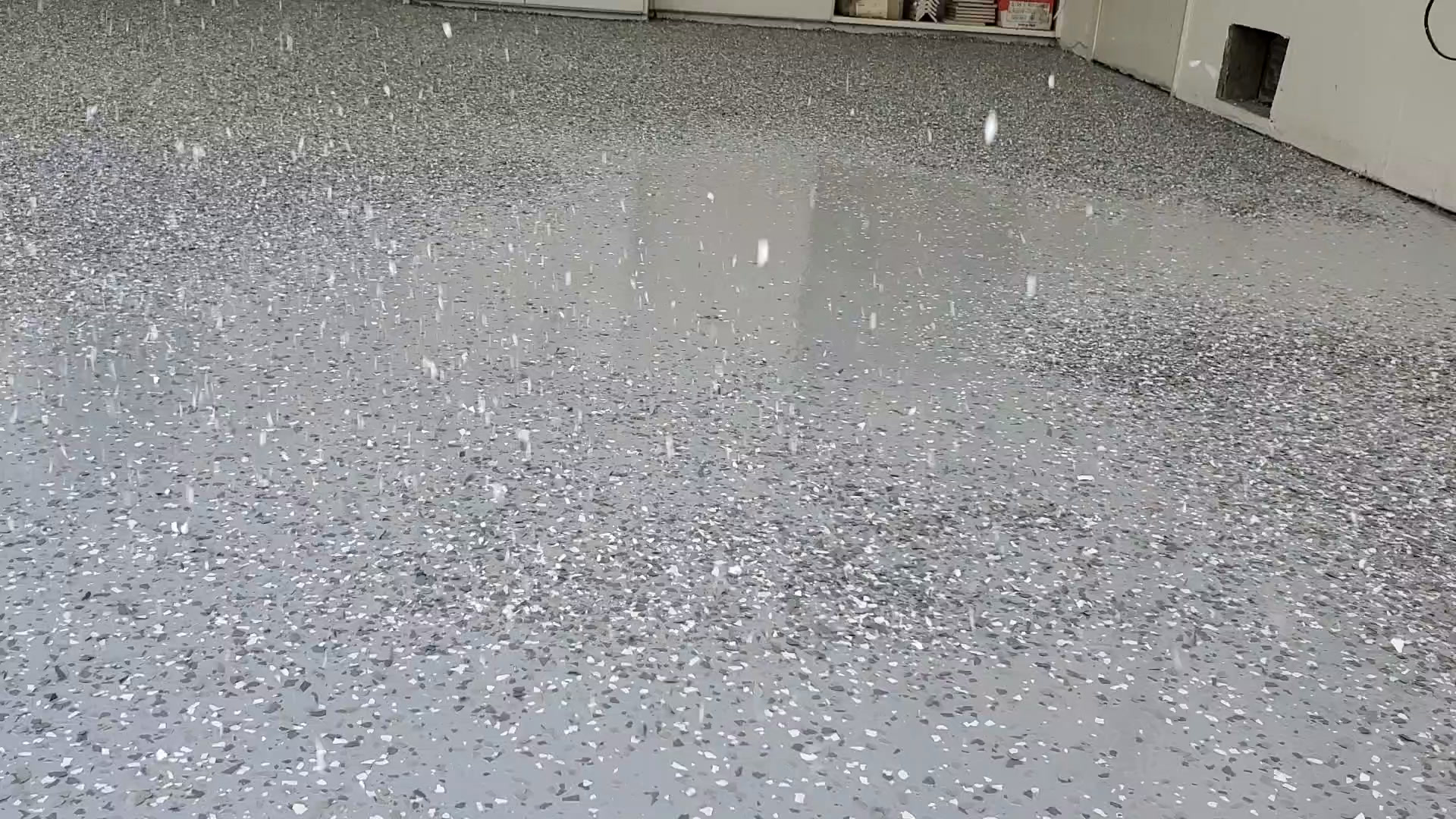 Flake broadcast mid-air onto wet basecoat